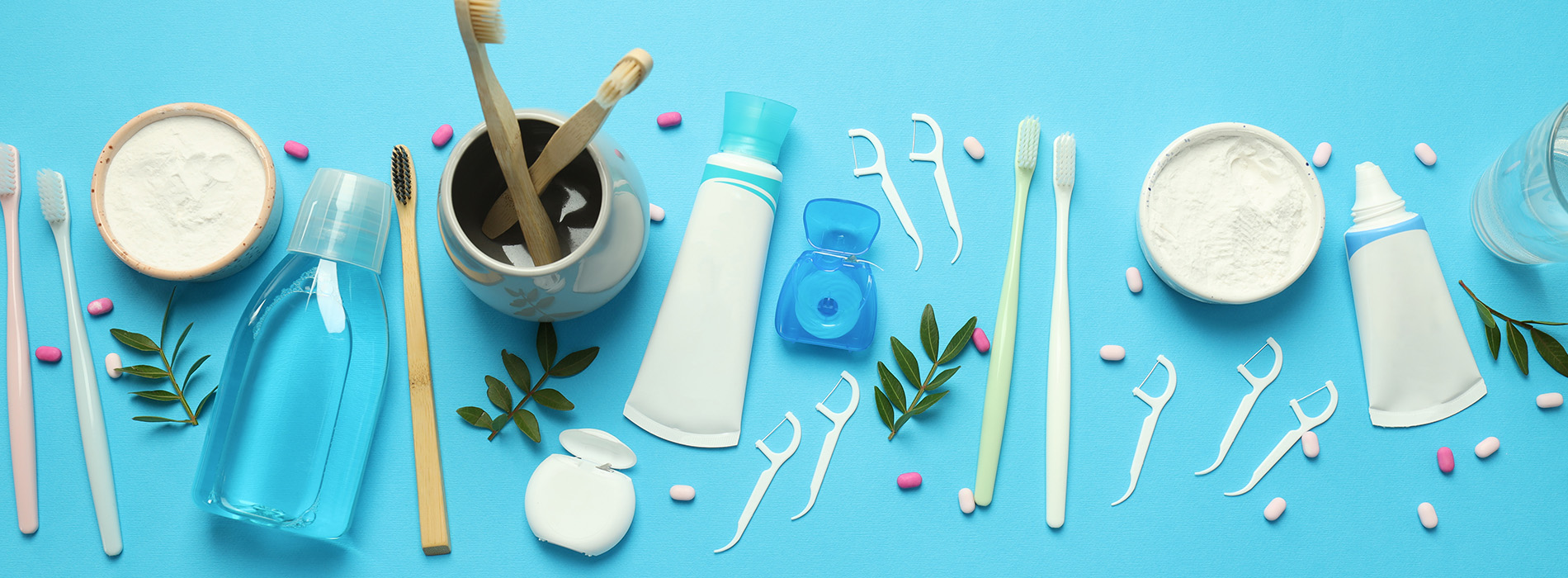 This is a composite image showing medical equipment and supplies, including a stethoscope, blood pressure cuff, tongue depressors, and other instruments, arranged in a manner that suggests they are part of a medical examination or procedure. The background is a solid color to emphasize the items.